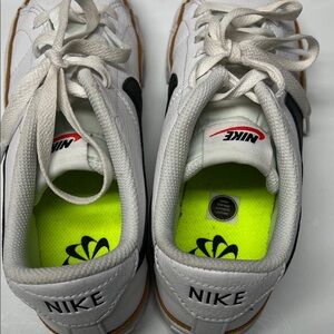 Nike Women’s White and Black Sneakers with Neon Accents